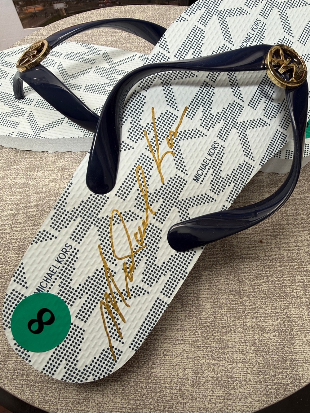Michael Kors Navy Flip Flops with White Signature Footbed and Gold Accents